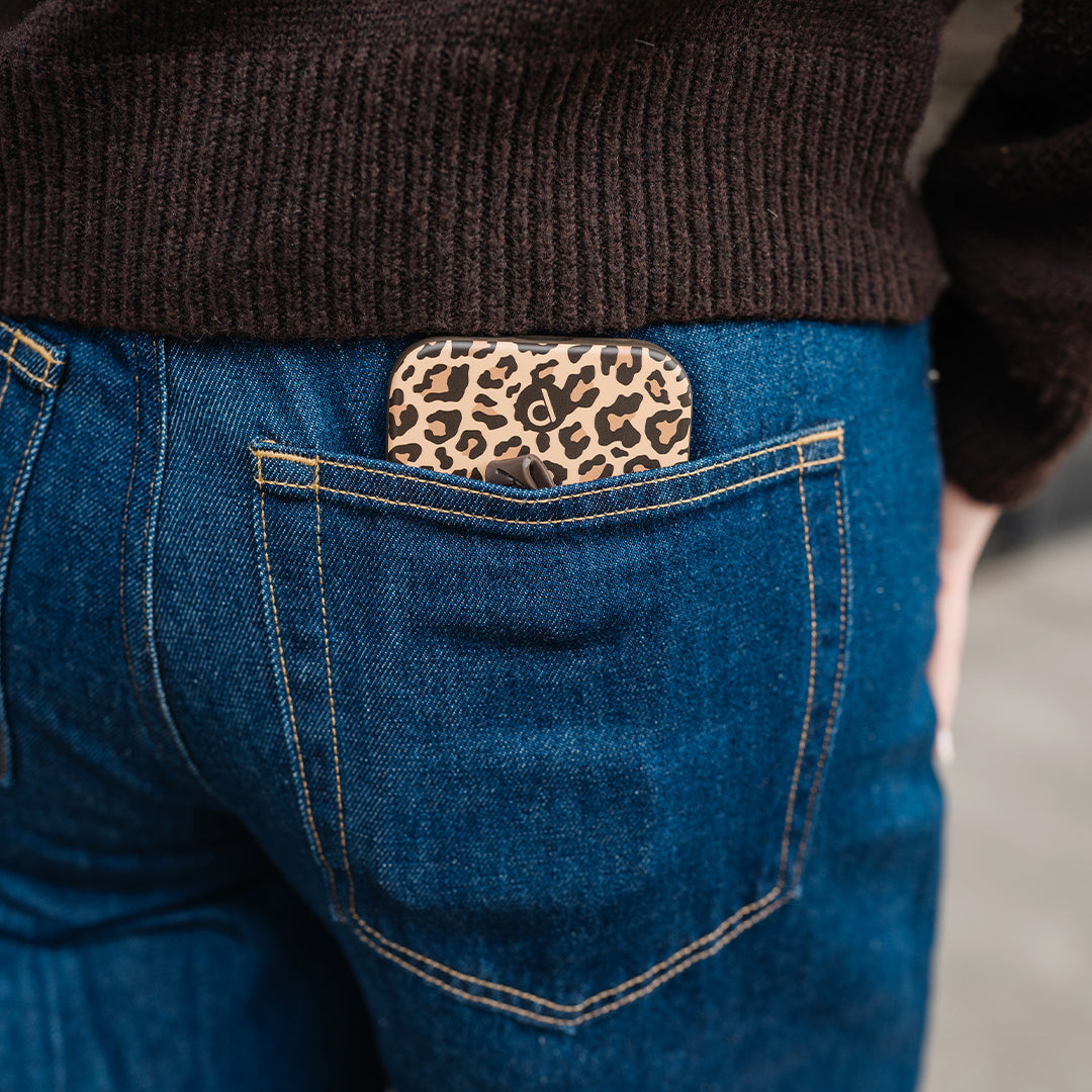 Phone case tucked into a jeans pocket